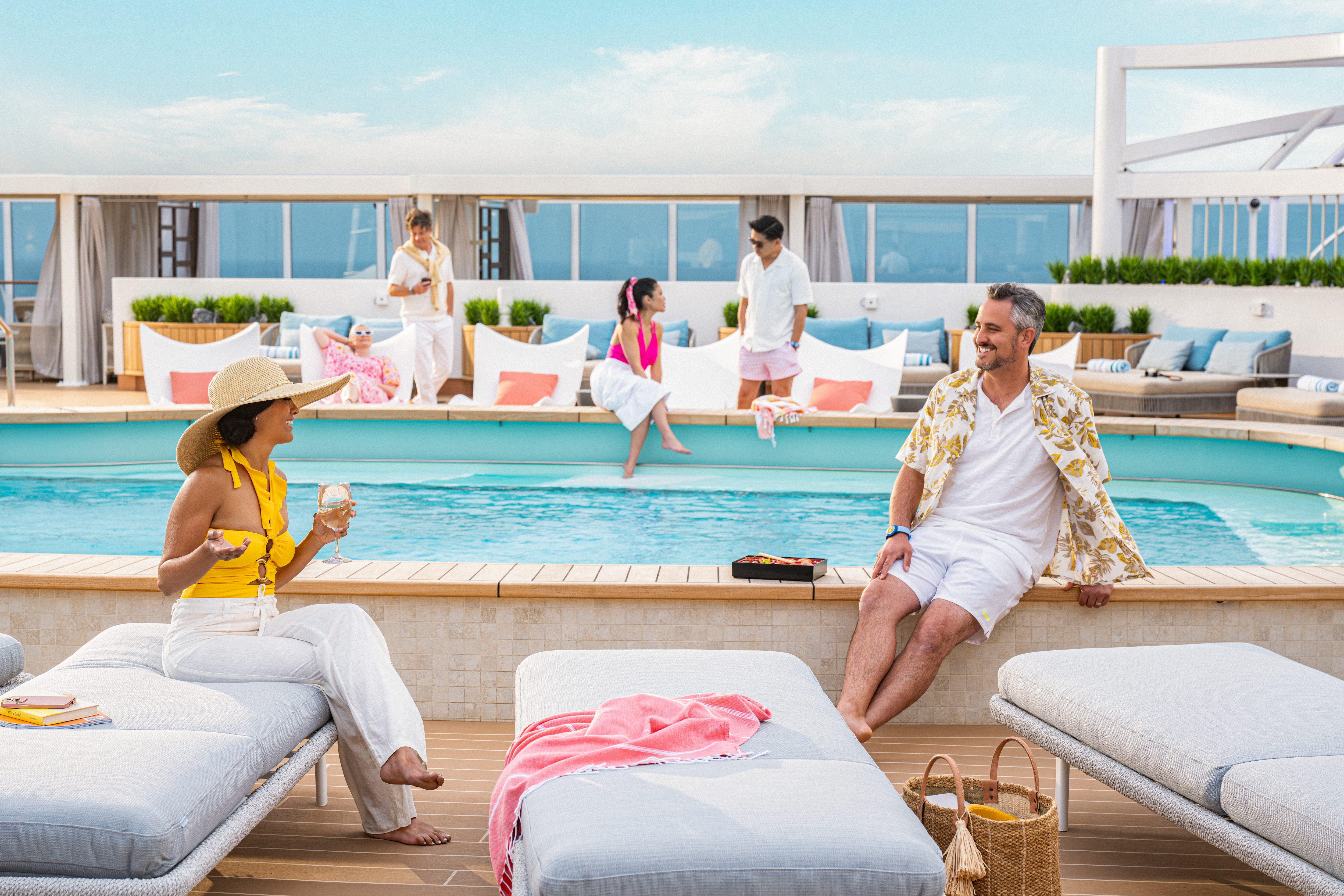 Two people enjoy the pool